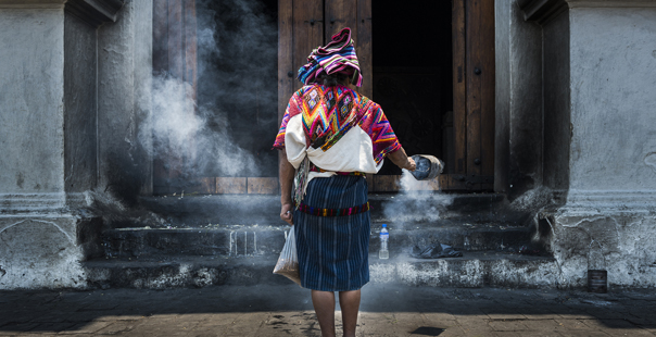Chichicastenango, Guatemala - April 26, 2014: Mayan woman performing a ritual in front of the Santo Tomás church in the town of Chichicastenango, in Guatemala